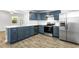 Modern kitchen featuring sleek stainless steel appliances, blue cabinets, quartz countertops, and stylish wood-look tile floors at 4739 Cook Sw Rd, Stockbridge, GA 30281