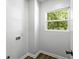 Laundry room includes washer hookups, a window offering natural light, and fresh neutral paint at 4739 Cook Sw Rd, Stockbridge, GA 30281