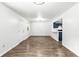 Bright and airy living room with stylish wood-look floors, connecting seamlessly to an updated kitchen area at 4739 Cook Sw Rd, Stockbridge, GA 30281