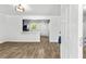 Inviting living room with modern flooring, open to the kitchen with an island and updated appliances at 4739 Cook Sw Rd, Stockbridge, GA 30281