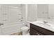 Bright bathroom featuring a shower-tub combination with a single sink vanity with a white countertop at 4825 Layton Drive, Lithia Springs, GA 30122