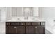 Bathroom featuring a double sink vanity with dark wood cabinets and white countertop at 4825 Layton Drive, Lithia Springs, GA 30122