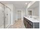 This bathroom features double sinks, a glass-enclosed shower, and a large mirror at 4825 Layton Drive, Lithia Springs, GA 30122