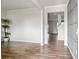A bright living room showcasing hardwood floors and a smooth transition into other parts of the home at 4825 Layton Drive, Lithia Springs, GA 30122