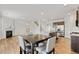A well-designed open-concept living space with a kitchen, fireplace, dining area, and seamless flow at 4825 Layton Drive, Lithia Springs, GA 30122