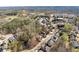 Aerial view of the neighborhood, highlighting the pond and surrounding homes at 1351 Ashbury Park Dr, Hoschton, GA 30548