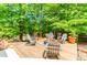 Outdoor deck with fire pit and Adirondack chairs, perfect for gatherings at 1351 Ashbury Park Dr, Hoschton, GA 30548