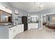 This bathroom boasts and vanities, granite countertops, and bright lighting at 1351 Ashbury Park Dr, Hoschton, GA 30548