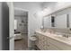 Well-appointed bathroom with double sinks and modern fixtures, connecting seamlessly to the adjoining bedroom at 1351 Ashbury Park Dr, Hoschton, GA 30548