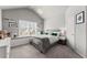 Bright bedroom with window seat, plush carpet, and cozy décor, creating a relaxing and inviting atmosphere at 1351 Ashbury Park Dr, Hoschton, GA 30548