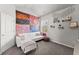 Eclectic bedroom with colorful tapestry, a comfortable couch, and unique decor, creating a personalized retreat at 1351 Ashbury Park Dr, Hoschton, GA 30548
