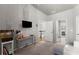 Bright bedroom with gray walls, a lofted ceiling, and decor including a macrame wall decoration and a modern loveseat at 1351 Ashbury Park Dr, Hoschton, GA 30548