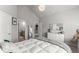 Inviting bedroom with a view into the bathroom, light walls, plush carpets, and neutral decor at 1351 Ashbury Park Dr, Hoschton, GA 30548