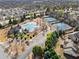 Aerial shot of the community pool, tennis courts, clubhouse, and parking at 1351 Ashbury Park Dr, Hoschton, GA 30548
