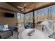 Relaxing covered porch with comfortable seating, ceiling fan, and outdoor television at 1351 Ashbury Park Dr, Hoschton, GA 30548