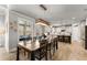 Dining area with hardwood flooring connects to the modern kitchen at 1351 Ashbury Park Dr, Hoschton, GA 30548