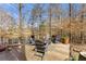 Enjoy outdoor living around the firepit on the deck with lake views, perfect for relaxing or entertaining at 1351 Ashbury Park Dr, Hoschton, GA 30548