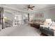 Cozy living room with plush seating, neutral colors, and an open layout perfect for relaxation and entertaining at 1351 Ashbury Park Dr, Hoschton, GA 30548