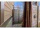 Unique outdoor shower featuring wood enclosure for privacy and natural stone base at 1351 Ashbury Park Dr, Hoschton, GA 30548