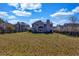 Large backyard featuring an expansive lawn and perimeter fencing at 6031 Autumn Green Dr, Fairburn, GA 30213