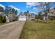 Two-story home with a two-car garage, stone accents, and a well-manicured lawn at 6031 Autumn Green Dr, Fairburn, GA 30213