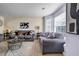 Comfortable living room with neutral tones, plush seating, and natural light at 6031 Autumn Green Dr, Fairburn, GA 30213