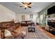 Inviting living room featuring hardwood floors, a fireplace, comfortable seating, and natural light at 6031 Autumn Green Dr, Fairburn, GA 30213