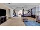 Expansive primary bedroom featuring a bed, seating area, and neutral decor throughout the space at 6031 Autumn Green Dr, Fairburn, GA 30213