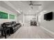 Finished basement featuring luxury vinyl flooring, a bar, and a black leather sofa at 4316 Woodland Bank Blvd, Buford, GA 30518