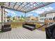 Exterior deck showcasing outdoor furniture and a wooden pergola with views of the backyard at 4316 Woodland Bank Blvd, Buford, GA 30518