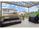 Exterior deck showcasing outdoor furniture and a grill, with views of the backyard at 4316 Woodland Bank Blvd, Buford, GA 30518