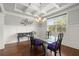 Bright dining room features hardwood floors, contemporary lighting, and modern decor at 4316 Woodland Bank Blvd, Buford, GA 30518