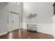 Bright foyer with hardwood floors, a decorative wall art, and a elegant console table at 4316 Woodland Bank Blvd, Buford, GA 30518