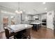 Gourmet kitchen features an eat-in island with room for seating and stainless appliances at 4316 Woodland Bank Blvd, Buford, GA 30518