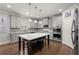 Spacious kitchen with gray cabinets, stainless steel appliances, and a center island at 4316 Woodland Bank Blvd, Buford, GA 30518