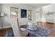 Living room with natural light, modern decor, and views of front yard at 4316 Woodland Bank Blvd, Buford, GA 30518