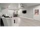 Spacious living room with bar area, bar seating, and doorway leading to outside deck at 4316 Woodland Bank Blvd, Buford, GA 30518
