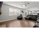 Open living area with a stone fireplace, built-in shelves, and a view of the kitchen at 4316 Woodland Bank Blvd, Buford, GA 30518