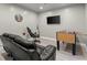 A recreation room is equipped with foosball table, big screen tv, and reclining seating at 4316 Woodland Bank Blvd, Buford, GA 30518