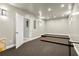 A spacious theater room boasts tiered seating, plush carpet, and ample space for entertainment at 4316 Woodland Bank Blvd, Buford, GA 30518
