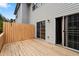 Cozy back deck with a wooden fence and sliding glass doors for outdoor relaxation at 700 Celeste Sw Ln, Atlanta, GA 30331