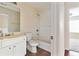 Neutral bathroom featuring a single vanity and shower-tub combo at 700 Celeste Sw Ln, Atlanta, GA 30331