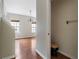A half bath with dark fixtures next to a living area with hardwood floors and natural light at 700 Celeste Sw Ln, Atlanta, GA 30331