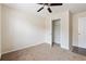 Cozy bedroom with neutral carpet and ceiling fan, offering a comfortable space at 700 Celeste Sw Ln, Atlanta, GA 30331