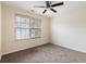 Bedroom featuring a window with blinds and neutral carpet at 700 Celeste Sw Ln, Atlanta, GA 30331