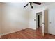 A neutral bedroom with laminate wood flooring and ceiling fan at 700 Celeste Sw Ln, Atlanta, GA 30331