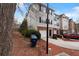 Townhouse with attached garages, traditional siding, and a yard with mature trees at 700 Celeste Sw Ln, Atlanta, GA 30331