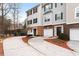 Townhouse with attached garage and driveway; traditional siding with manicured landscaping in the front yard at 700 Celeste Sw Ln, Atlanta, GA 30331