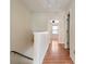 Upstairs hallway with wooden floors and natural light at 700 Celeste Sw Ln, Atlanta, GA 30331