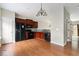 Bright kitchen features granite countertops, matching dark cabinetry, and an open floor plan at 700 Celeste Sw Ln, Atlanta, GA 30331